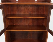 An Australian solid blackwood Arts & Crafts bookcase with pierced rail back, two bevelled glass doors, two lower open tiers and shaped feet, circa 1910, 146cm high, 98.5cm wide, 32cm deep - 3