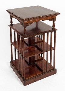 An Australian solid cedar ex-revolving set of bookshelves with gadrooned perimeter top, conforming plinth base, three tiers, turned pillars and carved brackets, 19th century, Note: Hoist post missing. 95.5cm high, 53cm wide, 53cm deep