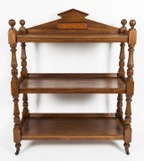 An antique Australian solid blackwood dumb waiter with Palladian panelled rail back, three&nbsp;tiers, incised bulbous pillars and ball finials, circa 1890, 131.5cm high, 105.5cm wide, 44cm deep