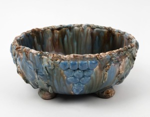 ARTIST UNKNOWN hand-built pottery fruit bowl with applied grapes and leaves, glazed in MASHMAN style finish and colourway, incised on the base (illegible), 10cm high, 23cm wide