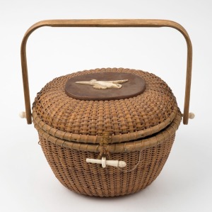 NANTUCKET basket with carved whalebone bird decoration and fittings, 19th century, 27cm high