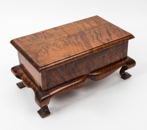 An Australian fiddleback blackwood jewellery casket with cabriole legs, finely crafted with choice cuts of timber, early 20th century, 15cm high, 31cm wide, 18cm deep