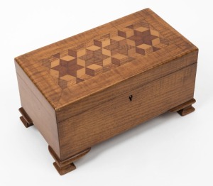 An antique Australian jewellery casket with tumbling box motif. Timbers include maple, ash, cedar and Queensland forest timbers, early 20th century, ​​​​​​​12cm high, 22cm wide, 12cm deep