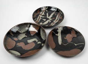 Three studio pottery fruit bowls, the largest 31.5cm diameter