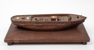 An antique Tasmanian oak boat hull with whale bone adornments, with Australian cedar base, 19th/20th century, 34.5cm long overall