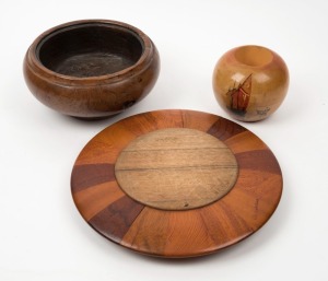 An Australian specimen wood mounted bread board, a huon pine hand-painted vase signed "V. Greig" and a burl red gum bowl, (3 items), the board 28cm diameter