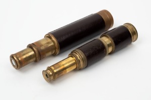 Two pocket telescopes, one five drawer by "T. Cook of London" and the other a three drawer, both with leather mounts, 19th century, the larger 46cm when expanded