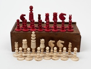 An antique whalebone chess set in cedar box, 19th century, the kings 7cm high, 2.4cm diameter