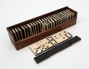 DOMINOES antique whalebone gaming tiles with ebony backs, 19th century