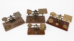 Four antique postal scales with assorted brass weights, 19th/20th century, ​​​​​​​the largest 21cm wide