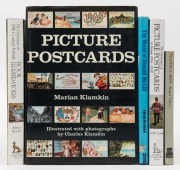 Picture post cards, playing cards etc; a group of five hard cover reference books.