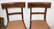 A set of four Australian cedar spade back dining chairs with tapering hexagonal form front legs, sabre rear legs and crinoline front rail, circa 1840 - 2
