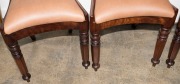 A set of four Australian cedar spade back dining chairs with tapering hexagonal form front legs, sabre rear legs and crinoline front rail, circa 1840 - 4