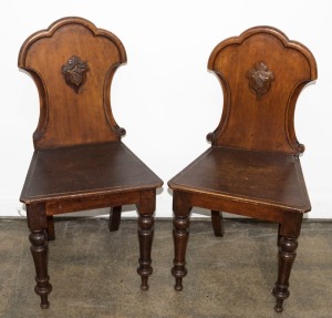 A pair of antique Australian cedar hall chairs with shield backs, 19th century, 90cm high, 45cm wide