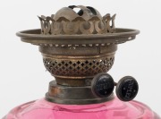 An antique oil lamp with black button double burner, faceted ruby glass font and Corinthian column base, 19th century, 52cm high - 2