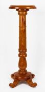 An Australian solid huon pine pedestal with circular top, conforming base, ring-turned bulbous trunk and four&nbsp;scrolled feet, late 19th century, 84.5cm high, 28.5cm diameter