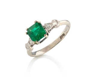 An 18ct white gold ring, set with a stunning natural cut emerald, flanked by brilliant cut white diamonds, with accompanying valuation ($8,200), ​​​​​​​2.6 grams total
