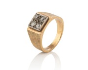 A 9ct white gold ring, set with four brilliant cut white diamonds in square white gold mounts, stamped "9ct", 8 grams total