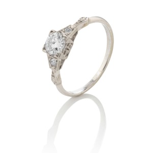 An 18ct white gold ring, set with a fine quality cut white diamond (approx. 0.5ct) flanked by a pair of diamonds, ​​​​​​​2.4 grams