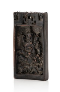 An antique Tibetan carved wooden amulet, 19th/20th century, 6.3cm high