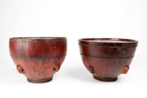 Two wooden covered storage vessels, each with four lugs, 23cm high