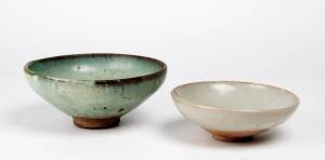 Two Chinese Junyao bowls, Yuan Dynasty 1280-1368, one covered with a pale blue glaze 18.8cm diameter, the other with a very pale blue glaze 15.8cm