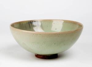 A large Junyao bowl, Yuan Dynasty 1280-1368, covered in a pale blue-green glaze. 22cm diameter