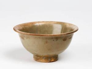 A small Yaozhou-type celadon bowl, Song Dynasty 960-1279, the interior with five raised vertical lines around the sides, pale green glaze. 11cm diameter