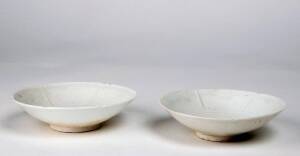 Two Chinese Qingbai foliate-rimmed six lobbed dishes, Southern Song Dynasty 1127-1279, each one with an unglazed ring in the centre and the character &lsquo;Zhong&rsquo; under the base. 13.4cm and 13.8cm diameter