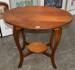 An Australian blackwood oval occasional table, circa 1920, ​​​​​​​76cm high, 88cm wide, 58cm deep.