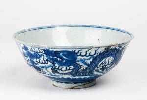 A Chinese blue and white dragon bowl, Kangxi mark, 20th century, 21cm diameter