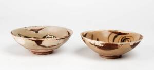 Two Chinese Changsha bowls, one painted in green and brown and the other in shades of brown, Tang Dynasty 618-906. 15cm and 15.4cm diameter. Provenance: Belitung Shipwreck