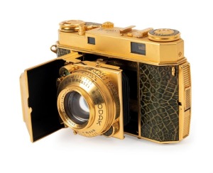 KODAK: Gold-plated Retina IIa rangefinder camera with snakeskin body, circa 1952, with Retina-Xenon 50mm f2 lens [#2938383] and Synchro-Compur shutter.