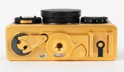 FRANKE & HEIDECKE: 1979 Rollei 35S compact camera [#0046/1500], in gold-plated edition marking the 60th anniversary of the Rollei company. In addition to being plated in 24-carat gold, the body is covered in lizard skin, bearing a uniquely numbered plate - 5