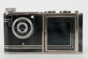 WALTER KUNIK: Petie Vanity subminiature camera for 14x14 exposures on 16mm film, circa 1956, with chrome and marble-green body. Front door opens to reveal mirror and original powder pad, which is present. - 3