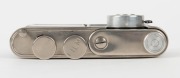 WALTER KUNIK: Petie Vanity subminiature camera for 14x14 exposures on 16mm film, circa 1956, with chrome and marble-green body. Front door opens to reveal mirror and original powder pad, which is present. - 5
