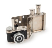 WALTER KUNIK: Petie Vanity subminiature camera for 14x14 exposures on 16mm film, circa 1956, with all-chrome body. Front door opens to reveal mirror and space for powder pad. - 2