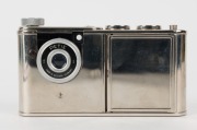 WALTER KUNIK: Petie Vanity subminiature camera for 14x14 exposures on 16mm film, circa 1956, with all-chrome body. Front door opens to reveal mirror and space for powder pad. - 3