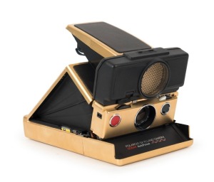 POLAROID: Limited-edition Polaroid SX-70 Land Camera Sonar AutoFocus [#65214600], circa 1981, with gold plating and leather body.