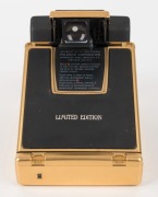 POLAROID: Limited-edition Polaroid SX-70 Land Camera Sonar AutoFocus [#65214600], circa 1981, with gold plating and leather body. - 2