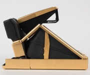 POLAROID: Limited-edition Polaroid SX-70 Land Camera Sonar AutoFocus [#65214600], circa 1981, with gold plating and leather body. - 4