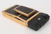 POLAROID: Limited-edition Polaroid SX-70 Land Camera Sonar AutoFocus [#65214600], circa 1981, with gold plating and leather body. - 5