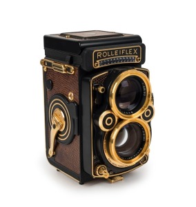 FRANKE & HEIDECKE: Rolleiflex 2.8F 1983 Aurum Edition gold-plated commemorative TLR camera [#8300420], with Xenotar and Heidosmat 80mm f2.8 lenses and alligator-leather covering. Presented in wooden maker's box with leather wrist strap.