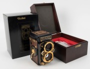 FRANKE & HEIDECKE: Rolleiflex&nbsp;2.8F 1983 Aurum Edition gold-plated commemorative TLR&nbsp;camera [#8300420], with Xenotar&nbsp;and&nbsp;Heidosmat&nbsp;80mm f2.8 lenses and&nbsp;alligator-leather covering. Presented in wooden maker's box with leather wrist strap. - 2
