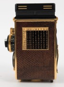 FRANKE & HEIDECKE: Rolleiflex&nbsp;2.8F 1983 Aurum Edition gold-plated commemorative TLR&nbsp;camera [#8300420], with Xenotar&nbsp;and&nbsp;Heidosmat&nbsp;80mm f2.8 lenses and&nbsp;alligator-leather covering. Presented in wooden maker's box with leather wrist strap. - 4