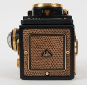 FRANKE & HEIDECKE: Rolleiflex&nbsp;2.8F 1983 Aurum Edition gold-plated commemorative TLR&nbsp;camera [#8300420], with Xenotar&nbsp;and&nbsp;Heidosmat&nbsp;80mm f2.8 lenses and&nbsp;alligator-leather covering. Presented in wooden maker's box with leather wrist strap. - 7