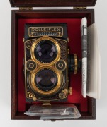 FRANKE & HEIDECKE: Rolleiflex&nbsp;2.8F 1983 Aurum Edition gold-plated commemorative TLR&nbsp;camera [#8300420], with Xenotar&nbsp;and&nbsp;Heidosmat&nbsp;80mm f2.8 lenses and&nbsp;alligator-leather covering. Presented in wooden maker's box with leather wrist strap. - 9