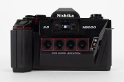 NISHIKA: Two N8000 3D cameras, circa 1980s, with 30mm quadra-lenses - one marked 'Made in China' [#274786], the other marked 'Made in Hong Kong' [#9263549]. Also included is a Nishika Twin Light 3010 shoe-mounted flash accessory, together with lens cleani - 2