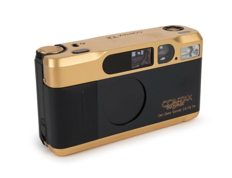 YASHICA: 1992 limited-edition Contax T2 60th Anniversary gold and black compact 35mm camera [#M-0001], in original timber and silk-lined presentation box, with leather case and straps.