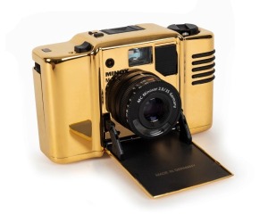 MINOX: 1992 Minox 35mm M.D.C. Gold Special-Edition compact camera [#7800555] with 24-carat gold-plated aluminium body, presented in original timber presentation case, together with maker's box, instruction booklet, and inspection certificate. One of only 